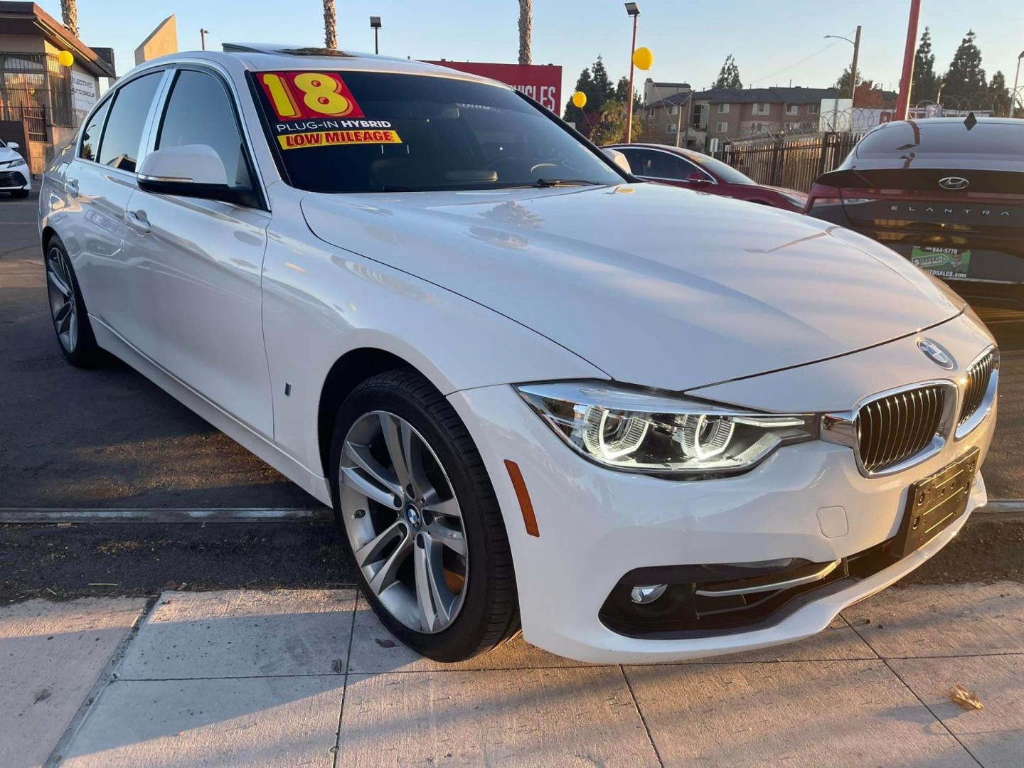 2018 WHITE /BLACK BMW 3-Series 330e iPerformance Sedan (WBA8E1C55JA) with an 2.0L L4 DOHC 16V HYBRID engine, Auto, 8-Spd Stptnc transmission, located at 744 E Miner Ave, Stockton, CA, 95202, (209) 944-5770, 37.956863, -121.282082 - PLUS TAXES AND FEES - Photo#0